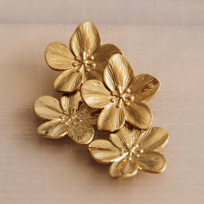 Edelstalen statement oorbel met 2 bloemen - goud
